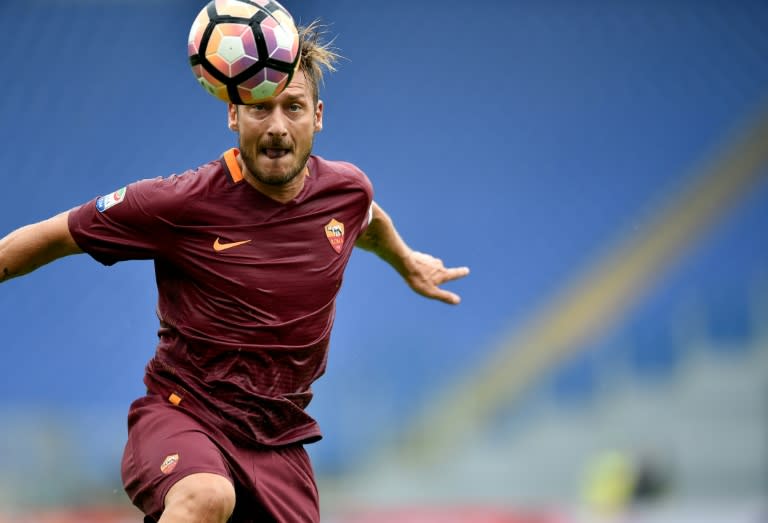 Real Madrid 's Cristiano Ronaldo says AS Roma's Francesco Totti "is an example for us all and someone we all look up to"