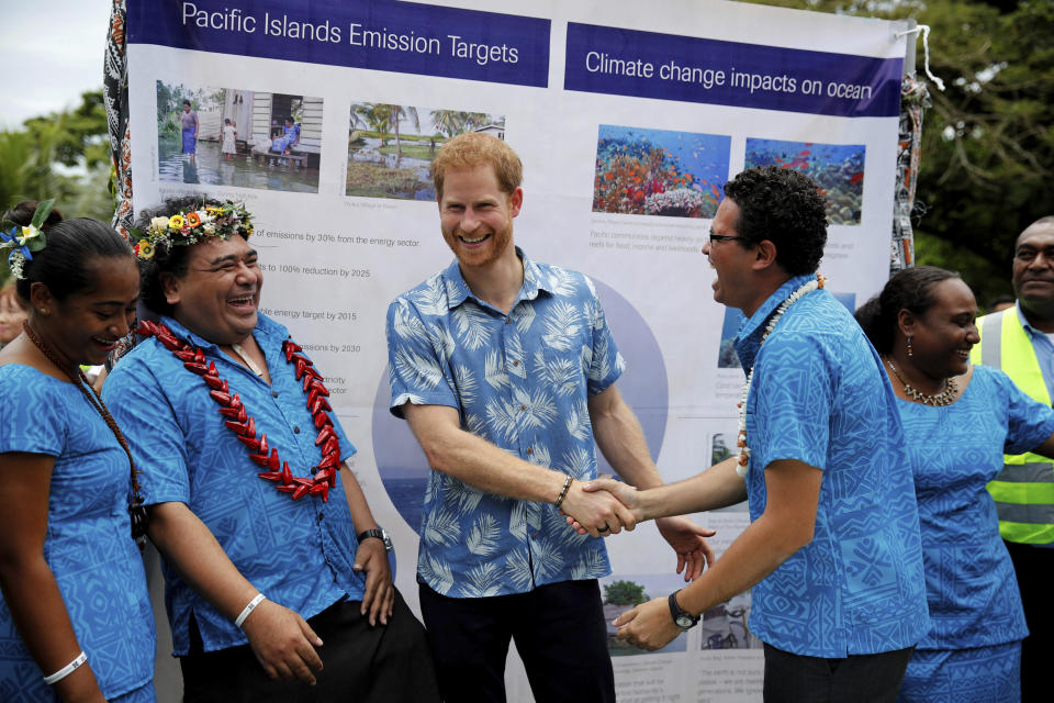 Britain's Prince Harry meets with students during a visit to the University of the South Pacific in Suva, Fiji, Wednesday, Oct. 24, 2018. Prince Harry and his wife Meghan are on day nine of their 16-day tour of Australia and the South Pacific (Phil Noble/Pool Photo via AP)