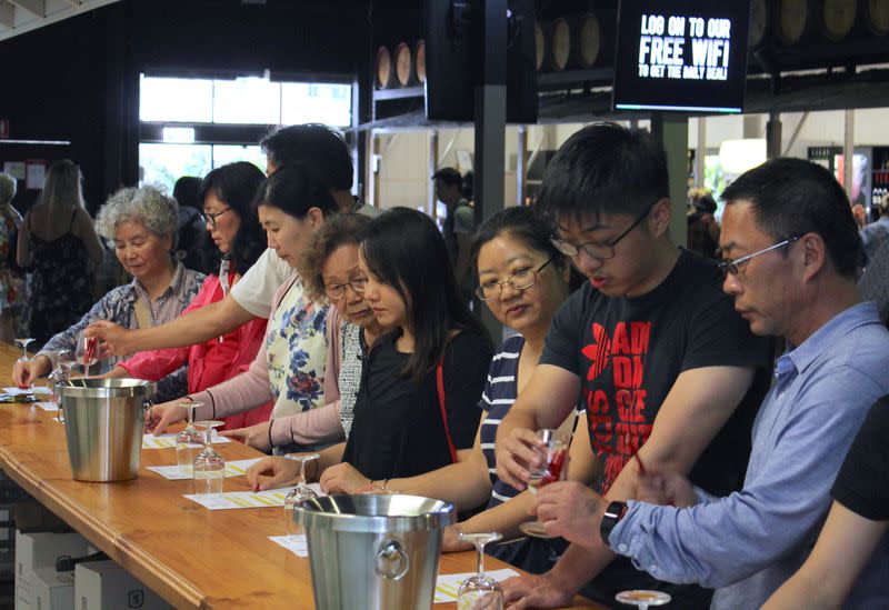 FILE PHOTO: Chinese tourists sample wine at McGuigan Winery in the Hunter Valley, located north of Sydney