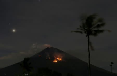 Fire is seen on the slopes of Mount Agung volcano following an eruption as seen from Amed in Karangasem Regency, Bali, Indonesia July 3, 2018. REUTERS/Johannes P. Christo
