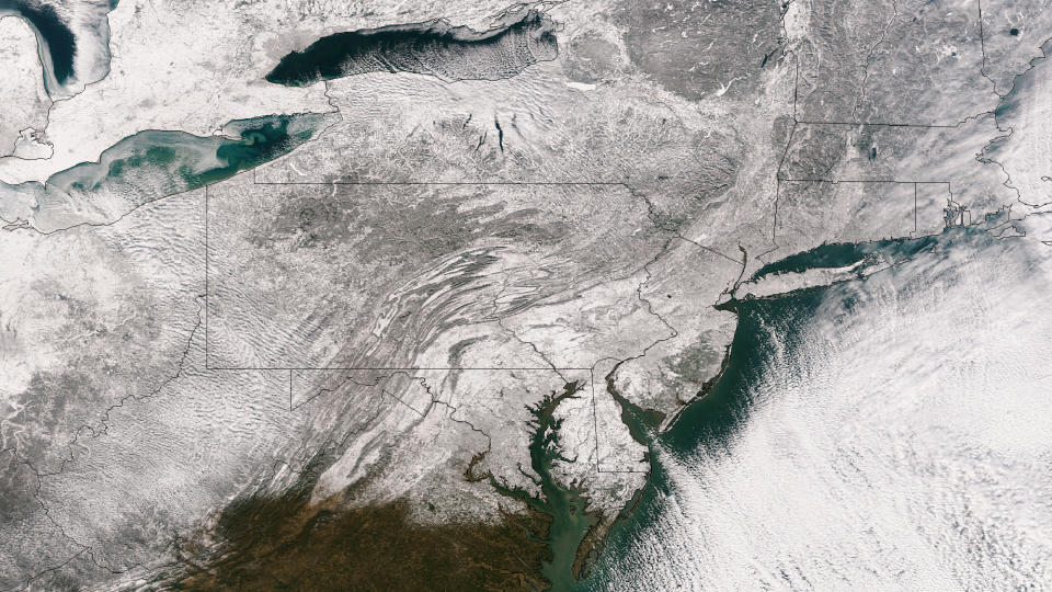 This Friday, Jan. 3, 2014 satellite image provided by the National Oceanic and Atmospheric Administration shows the blanket of snow that stretches from the Midwest across to New England after a massive winter storm moved over the region. Many areas received up to or more than a foot of snow, and the National Weather Service is warning that another system is moving across the Plains with the potential to bring more snow to the Midwest and Great Lakes regions on Jan. 4. (AP Photo/National Oceanic and Atmospheric Administration)