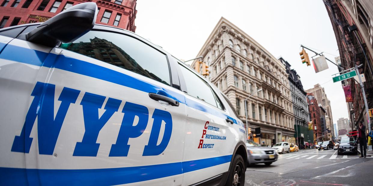 Close up of the NYPD logo on a police car.