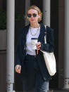 <p>Carey Mulligan takes her coffee to-go in N.Y.C. on May 20.</p>