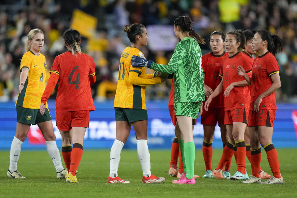 Australian and Chinese players react following the women's international soccer friendly between China and Australia at Stadium Australia, in Sydney, Monday, June 3, 2024. (AP Photo/Rick Rycroft)