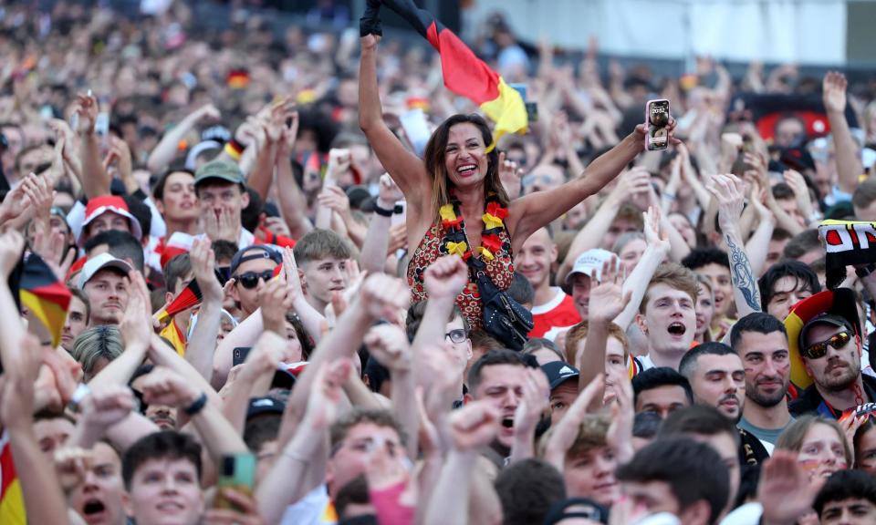 <span>German supporters gather in Berlin to watch the Euro 2024 match against Switzerland.</span><span>Photograph: Joerg Carstensen/AFP/Getty Images</span>