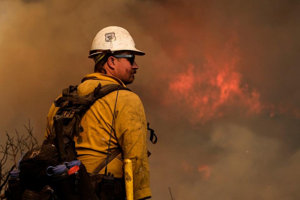 A firefighter this week in California, where blazes are an increasing threat as drought conditions intensify (AP)