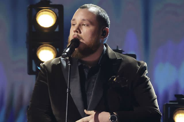 <p>Kevin Winter/Getty</p> Luke Combs performs onstage during the 66th GRAMMY Awards at Crypto.com Arena on February 4, 2024 in Los Angeles, California.