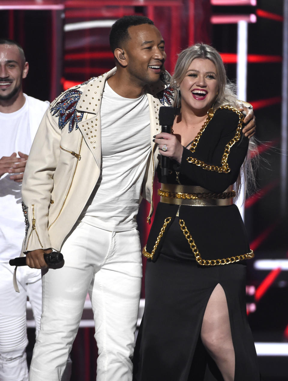 Host Kelly Clarkson, right, and John Legend appear on stage at the Billboard Music Awards at the MGM Grand Garden Arena on Sunday, May 20, 2018, in Las Vegas. (Photo by Chris Pizzello/Invision/AP)