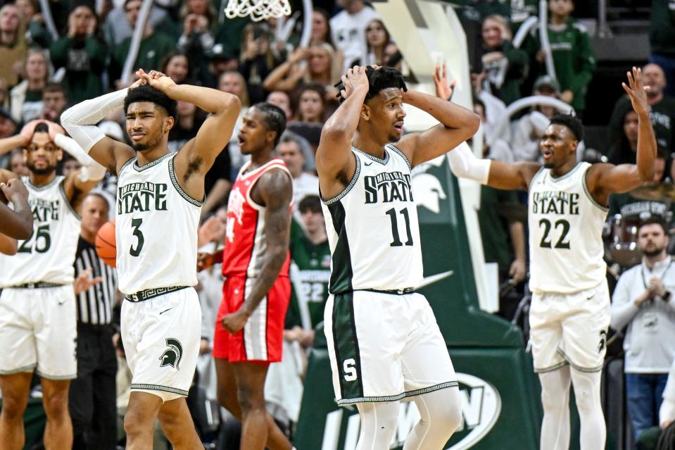 From left, Michigan State's Jaden Akins, A.J. Hoggard and Mady Sissoko react after Sissoko is called for a foul against Ohio State during the second half on Sunday, Feb. 25, 2024, at the Breslin Center in East Lansing.