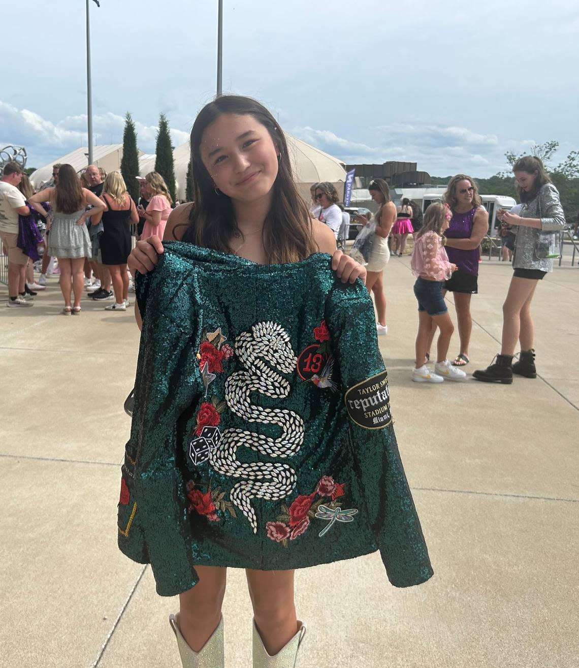 Caydence, 14, shows off the green sparkly “Reputation” era jacket she and her mom made to wear to the Taylor Swift concert at Arrowhead.