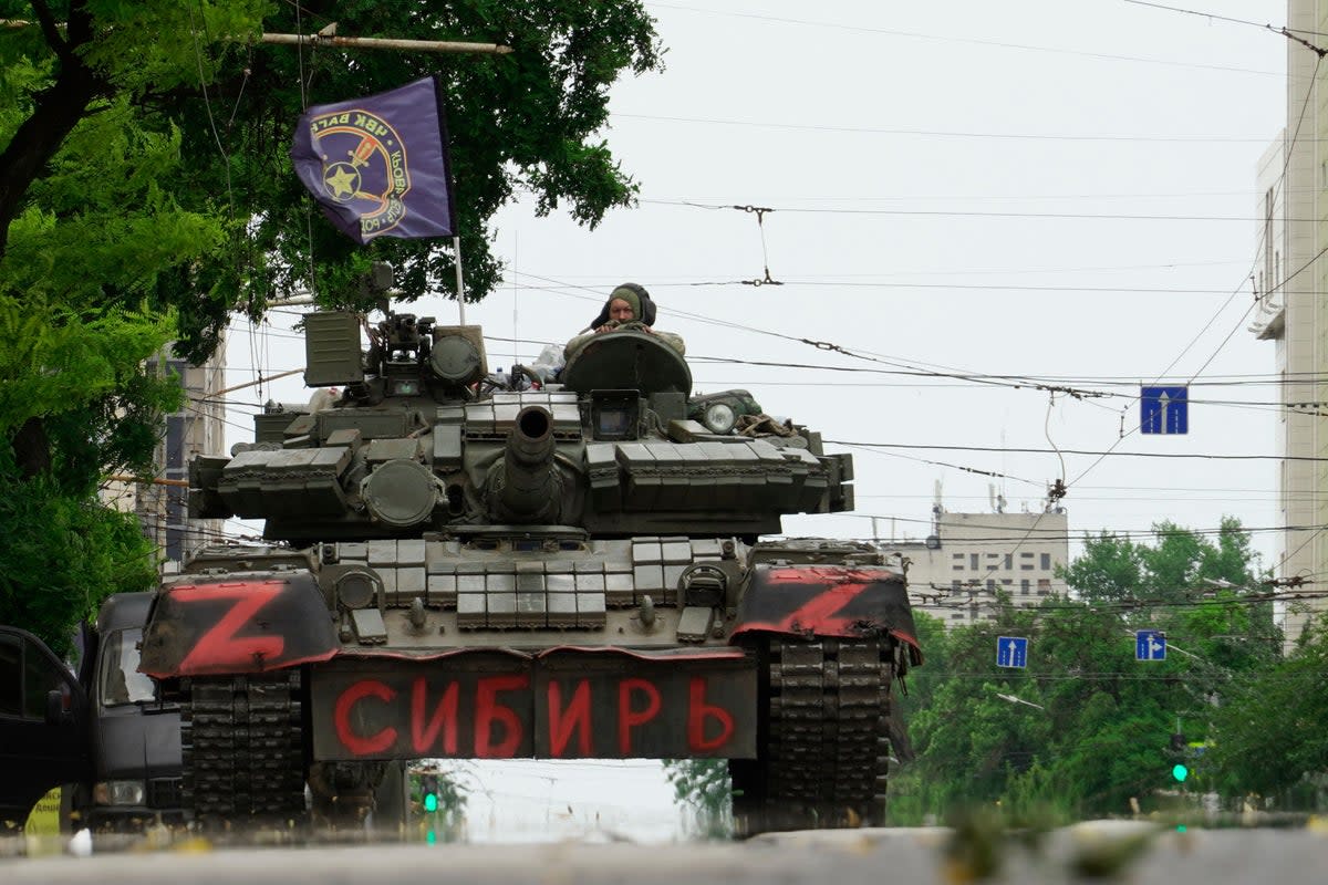 Members of Wagner group sit atop of a tank in a street in the city of Rostov-on-Don, on June 24, 2023 (AFP via Getty Images)