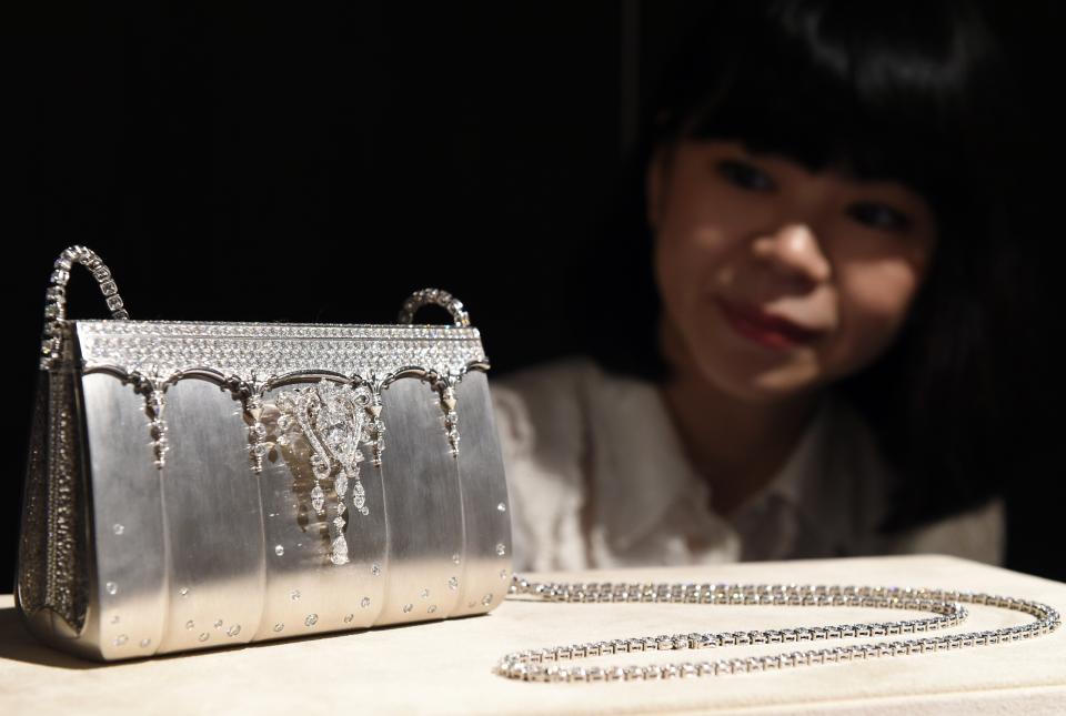 worlds most expensive hermes birkin bags, A Ginza Tanaka employee shows off 200-million-yen (1,626,016 USD) diamond bijou bag made of 208ct, 2182-diamonds and platinum during a platinum exhibition press preview in Tokyo on June 18, 2015. Japan's jewelry company, Ginza Tanaka will hold the exhibition, "The Story of Platinum" together with Platinum Guild International from June 19 to July 31.          AFP PHOTO / TOSHIFUMI KITAMURA        (Photo credit should read TOSHIFUMI KITAMURA/AFP via Getty Images)