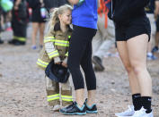 <p>Lila McConnell, 4, waits with her mother before the start of the, 10th annual, Colorado 9/11 Stair Climb at Red Rocks Amphitheatre on September 11, 2018 in Morrison, Colo. Lila’s father is a firefighter for South Metro Fire in Parker, Colorado. (Photo: R.J. Sangosti/The Denver Post via Getty Images) </p>