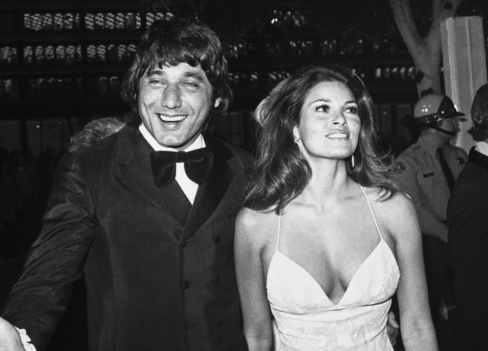 FILE - New York Jets football player Joe Namath arrives with actress Raquel Welch to the 44th annual Academy Awards ceremony in Los Angeles on April 10, 1972. Welch, whose emergence from the sea in a skimpy, furry bikini in the film “One Million Years B.C.” would propel her to international sex symbol status throughout the 1960s and '70s, died early Wednesday, Feb. 15, 2023, after a brief illness. She was 82. (AP Photo, File)