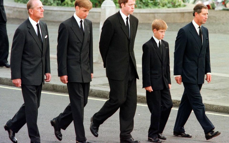 Prince Harry walks behind his mother's coffin aged 12