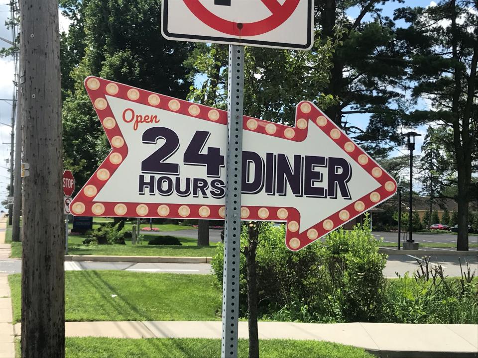 A sign touting that the new Concord Diner on Concord Pike is open 24 hours.