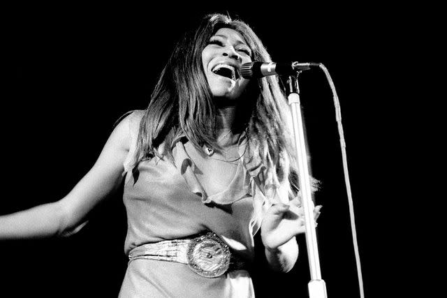 <p>Redferns/Getty</p> Tina Turner performs in 1972