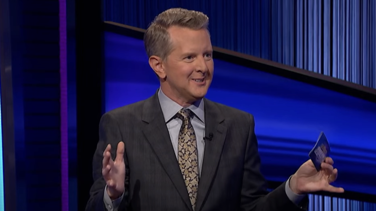  Ken Jennings smiling while hosting Celebrity Jeopardy. 