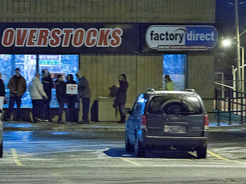  A lineup outside a Factory Direct store in Brantford, Ont., on Black Friday in 2014.