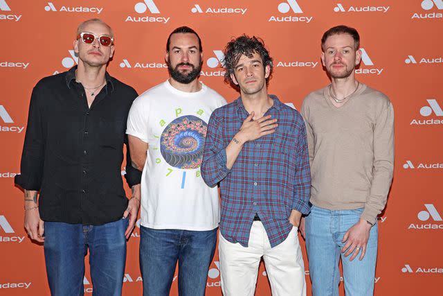 <p> John Parra/Getty </p> George Daniel, Ross MacDonald, Matty Healy and Adam Hann of The 1975 in December 2022