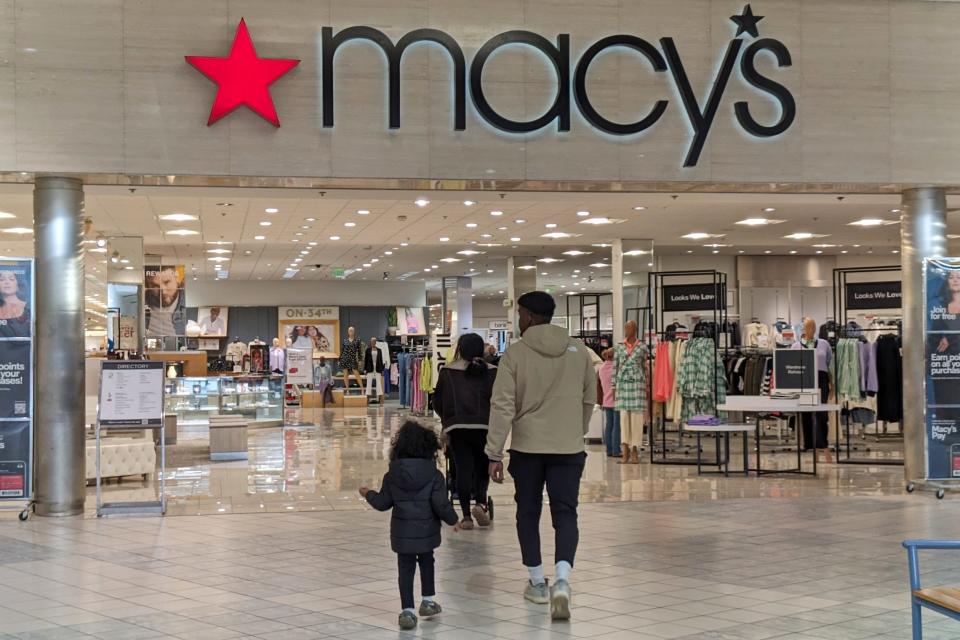 Shoppers walk into Macy's in Dartmouth on Friday afternoon. According to a spokesperson for Macy's, the store at the Dartmouth Mall will remain open.