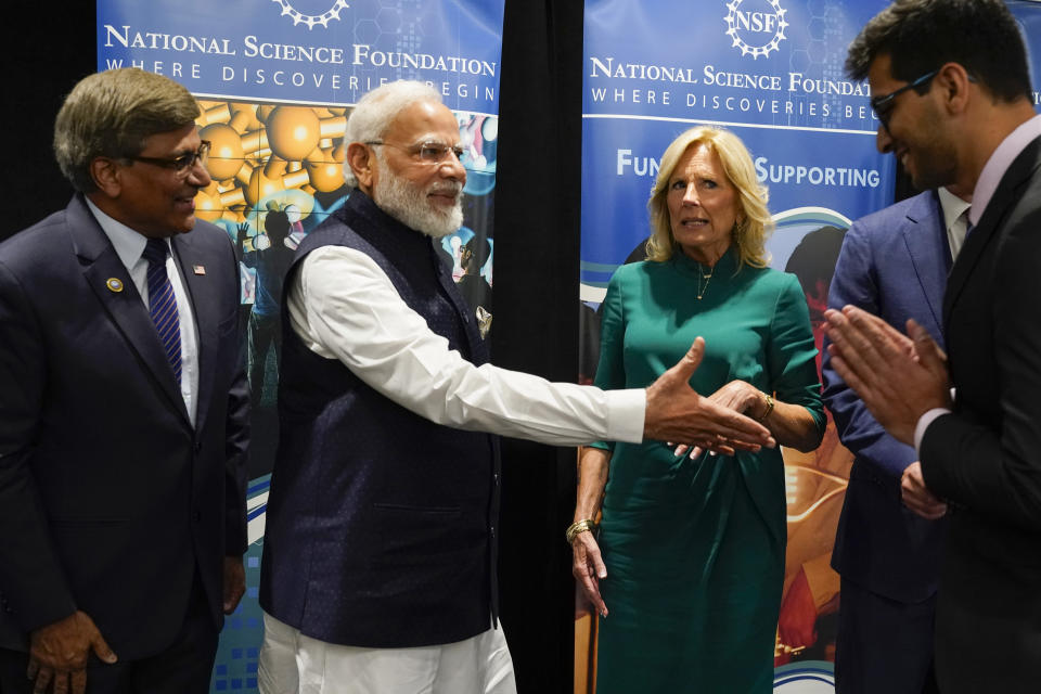 First lady Jill Biden and India's Prime Minister Narendra Modi greet Kaustubh Joshi, an Indian PhD student currently studying in the United States, as they visit the National Science Foundation in Alexandria, Va., Wednesday June, 21, 2023. Watching are Sethuraman Panchanathan, director of the National Science Foundation, left, and U.S. Ambassador to India Eric Garcetti. (AP Photo/Jacquelyn Martin)