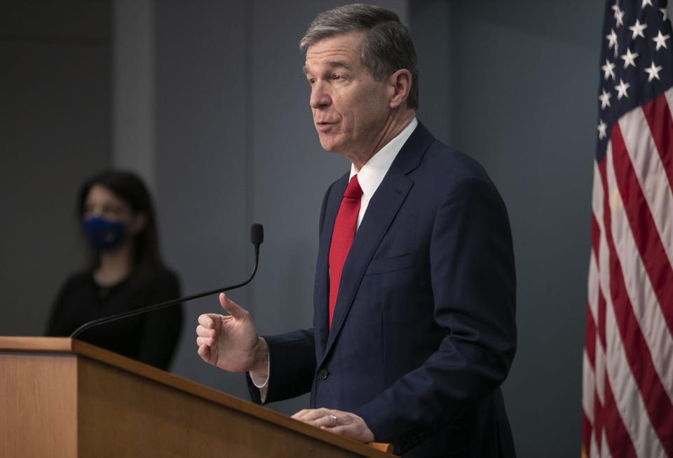 North Carolina Governor Roy Cooper speaks during a press briefing on the COVID-19 virus and vaccination efforts on Tuesday, March 2, 2021, at the Emergency Operations Center in Raleigh, N.C. (Robert Willett/The News & Observer via AP)