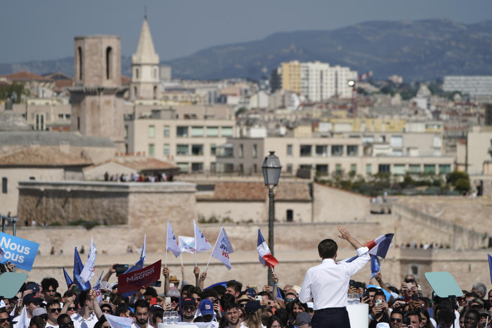 French President and centrist candidate Emmanuel Macron speaks during a campaign rally, Saturday, April 16, 2022 in Marseille, southern France. Far-right leader Marine Le Pen is trying to unseat centrist President Emmanuel Macron, who has a slim lead in polls ahead of France's April 24 presidential runoff election. (AP Photo/Laurent Cipriani)