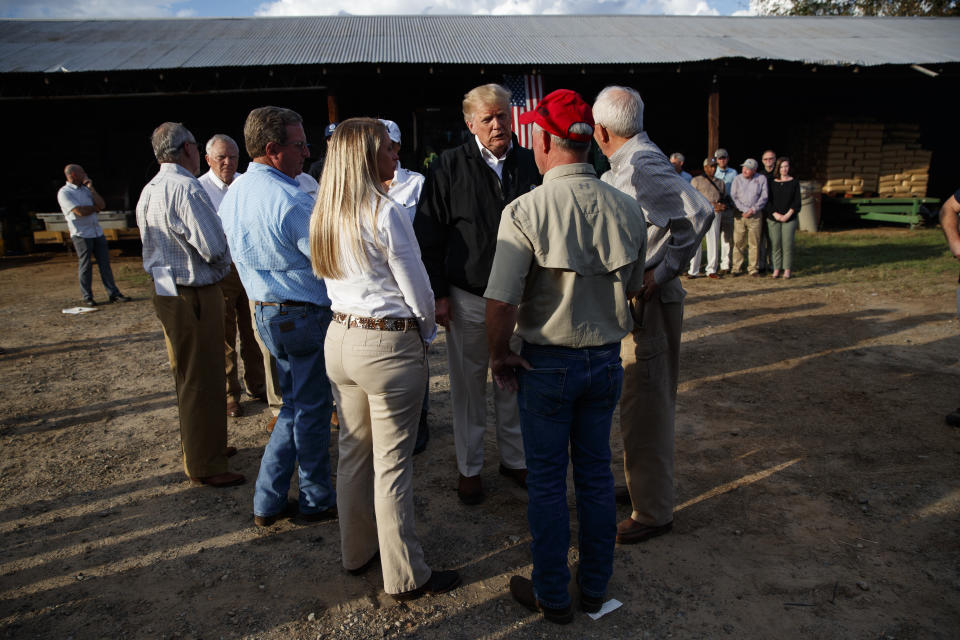 President Donald Trump meets with farmers impacted by Hurricane Michael, Monday, Oct. 15, 2018, in Macon, Ga. (AP Photo/Evan Vucci)