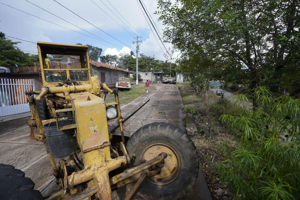 A bulldozer blocks an entrance to the army barracks, placed there by angry residents in Aguililla, in the Michoacan state of Mexico, Friday, Oct. 29, 2021. It is part of an increasing trend in Mexico: Soldiers have been taken hostage by townspeople because they know troops won’t even defend themselves under President Andrés Manuel López Obrador’s policy of “hugs, not bullets.” (AP Photo/Eduardo Verdugo)