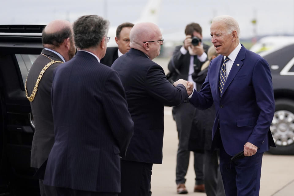 President Joe Biden arrives at Edinburgh Airport to attend the COP26 U.N. Climate Summit, Monday, Nov. 1, 2021, in Edinburgh, Scotland. The President is greeted by T.H. Philip Reeker, Chargé d'affaires, Embassy of the United States to the United Kingdom of Great Britain and Northern Ireland, Councilor Frank Ross, Right Honorable Lord Provost and Lord Lieutenant of the City of Edinburgh and Nicholas Jarrold, Special Representative of the Foreign Secretary. (AP Photo/Evan Vucci)