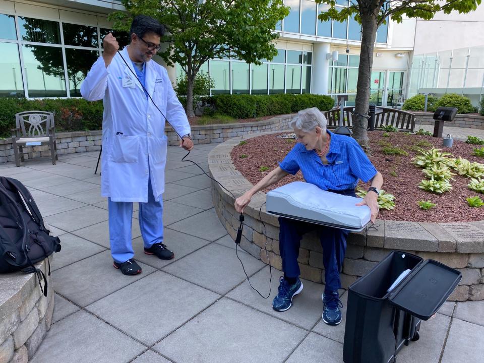 Mary Korte, 76 of Mequon, shows the device she uses to manage her heart failure with the help of Aurora St. Luke's cardiothoracic surgeon Nasir Sulemanjee. The implanted device, made by Abbott, allows Korte's medical team track her condition and adjust her medications from just about anywhere.