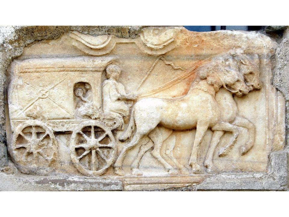 Covered Wagon relief from a Roman tombstone now in the church wall of Maria Saal, Klagenfurt, Austria. Edited copy of a photograph (Johann Jaritz)