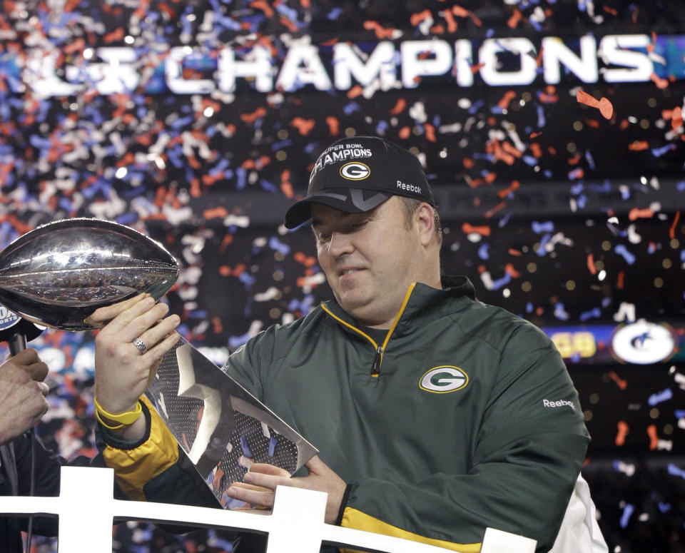 FILE - Green Bay Packers head coach Mike McCarthy holds the Vince Lombardi Trophy after beating the Pittsburgh Steelers 31-25 in the NFL Super Bowl XLV football game Sunday, Feb. 6, 2011, in Arlington, Texas. Everybody wants to know what's going through the mind of the man who led the Packers to a Super Bowl title before an unhappy ending with a midseason firing almost eight years later. (AP Photo/David J. Phillip, File)