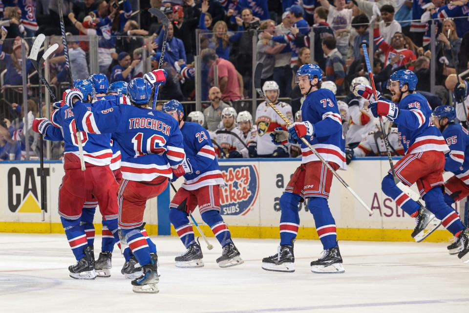 May 24, 2024; New York, New York, USA; New York Rangers center Barclay Goodrow (21) celebrates his game-winning overtime goal with teammates in game two of the Eastern Conference Final of the 2024 Stanley Cup Playoffs against the Florida Panthers at Madison Square Garden. Mandatory Credit: Vincent Carchietta-USA TODAY Sports