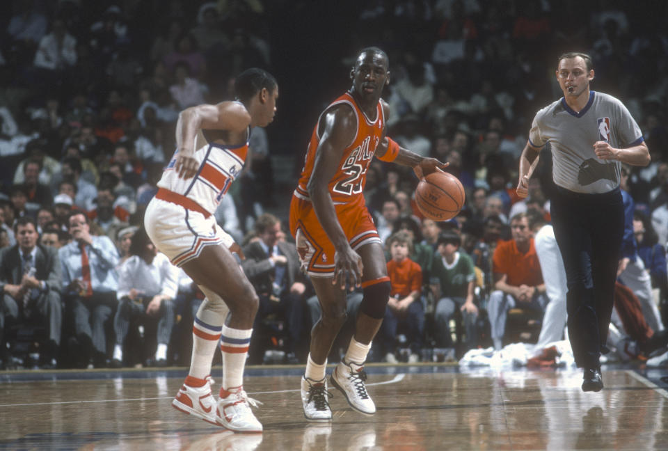 LANDOVER, MD - CIRCA 1986: Michael Jordan #23 of the Chicago Bulls dribbles the ball up court against the Washington Bullets during an NBA basketball game circa 1986 at the Capital Centre in Landover, Maryland. Jordan played for the Bulls from 1984-93 and 1995 - 98. (Photo by Focus on Sport/Getty Images) *** Local Caption *** Michael Jordan