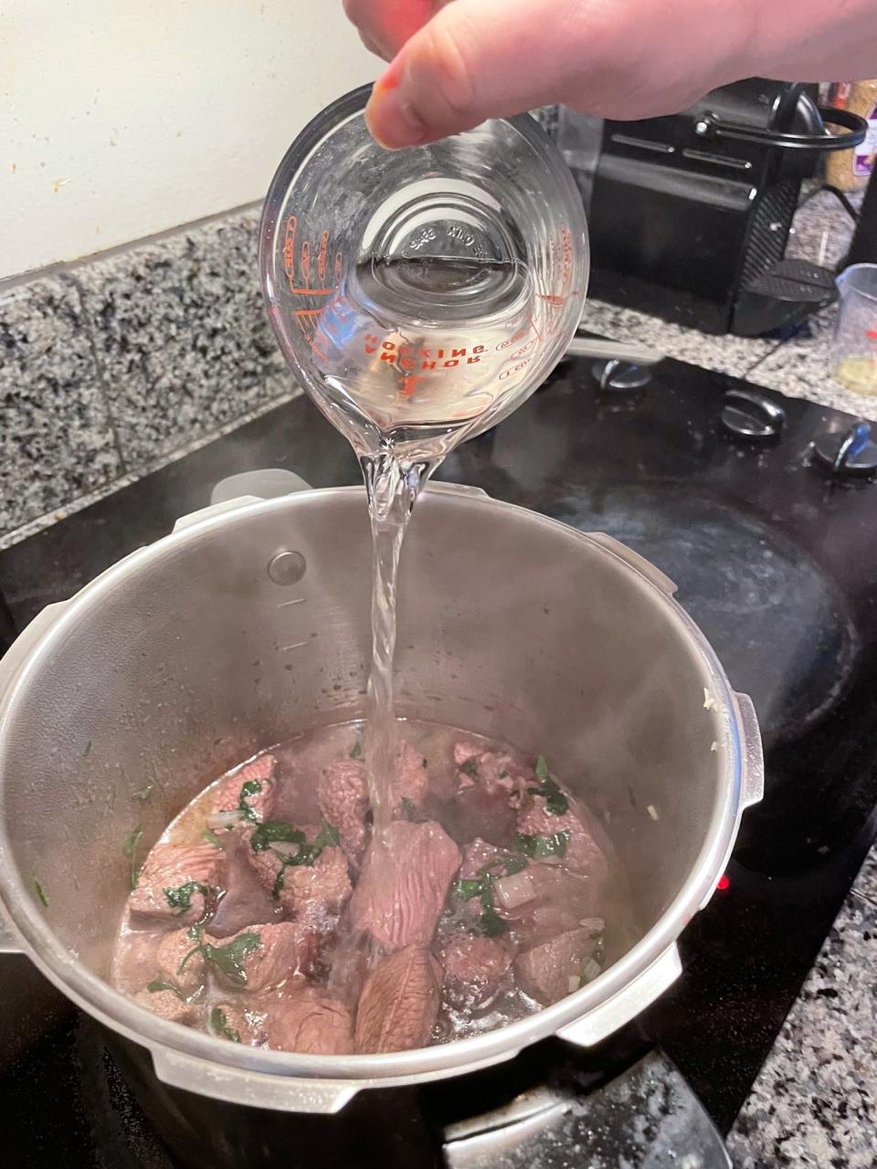 Adding water to Greek dad's kritharaki