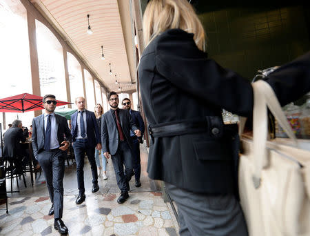 People walks during lunch break downtown Milan, Italy, September 15, 2017. Picture taken September 15, 2017. REUTERS/Massimo Pinca