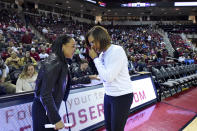 South Carolina head coach Dawn Staley, left, and LSU head coach Nikki Fargas laugh before an NCAA college basketball game Thursday, Feb. 20, 2020, in Columbia, S.C. (AP Photo/Richard Shiro)