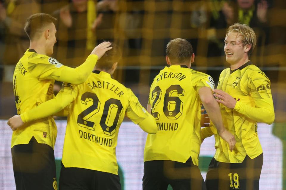 Julian Brandt (right) celebrates with teammates after scoring Dortmund's second goal (Getty)