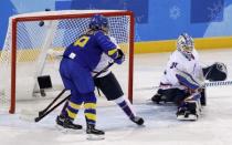 Ice Hockey - Pyeongchang 2018 Winter Olympics - Women’s Classification Match - Sweden v Korea - Kwandong Hockey Centre, Gangneung, South Korea - February 20, 2018 - Annie Svedin of Sweden (unseen) scores against Shin So-jung of Korea. REUTERS/David W Cerny