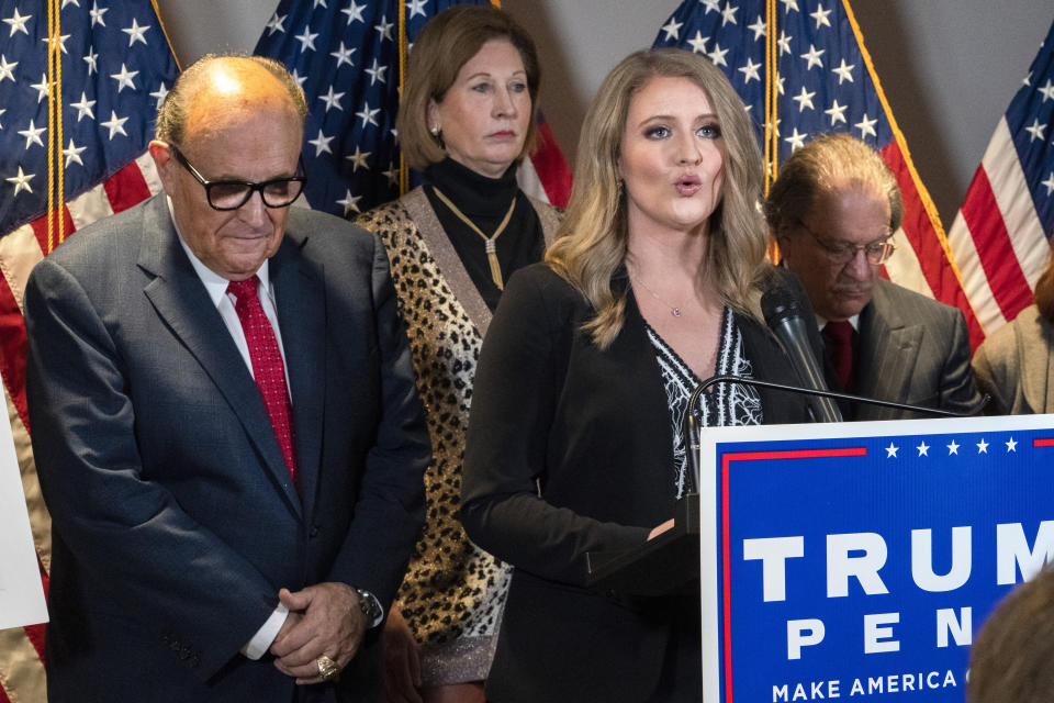 Jenna Ellis speaking at a podium.