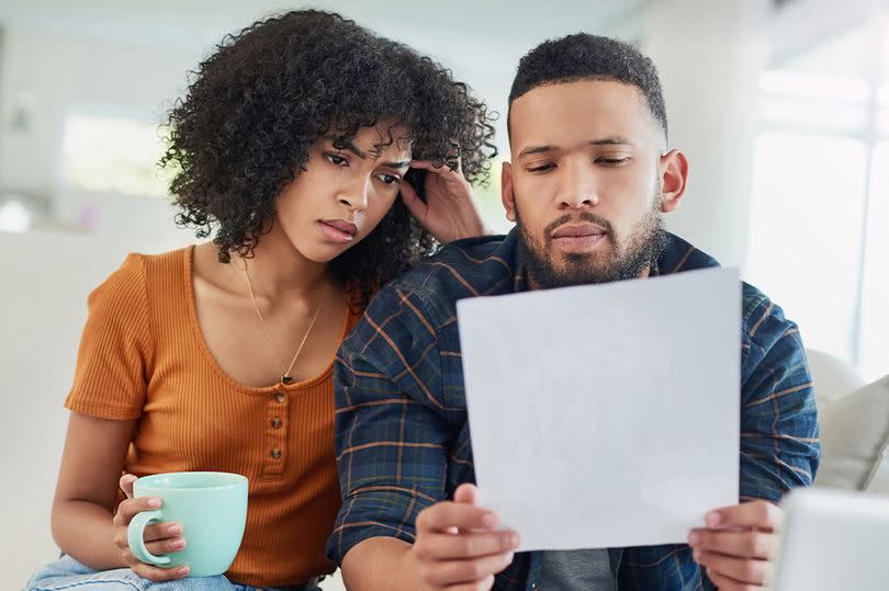 A couple check their bills