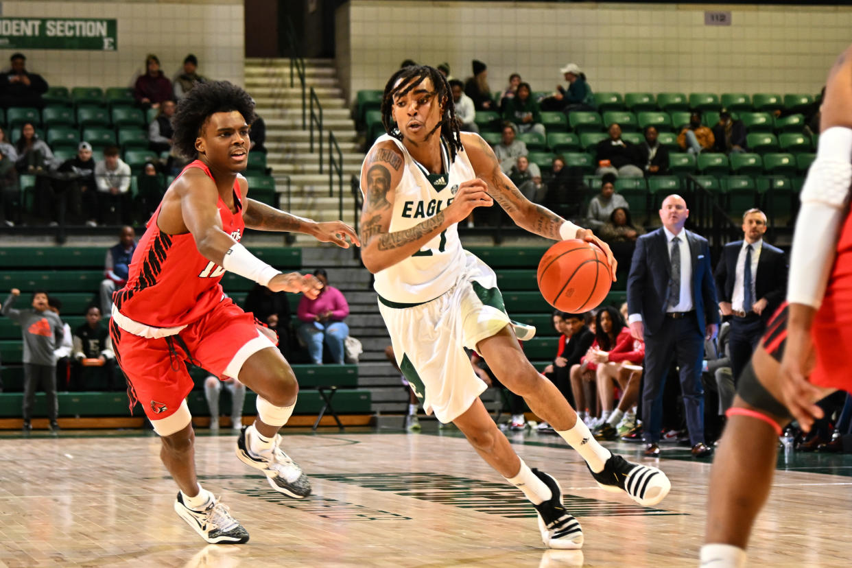 YPSILANTI, MI - FEBRUARY 25: Eastern Michigan Eagles forward Emoni Bates (21) drives hard past Ball State Cardinals guard Jaylin Sellers (12) during the Eastern Michigan Eagles game versus the Ball State Cardinals on Saturday February 25, 2023 at the George Gervin GameAbove Center in Ypsilanti, MI. (Photo by Steven King/Icon Sportswire via Getty Images)