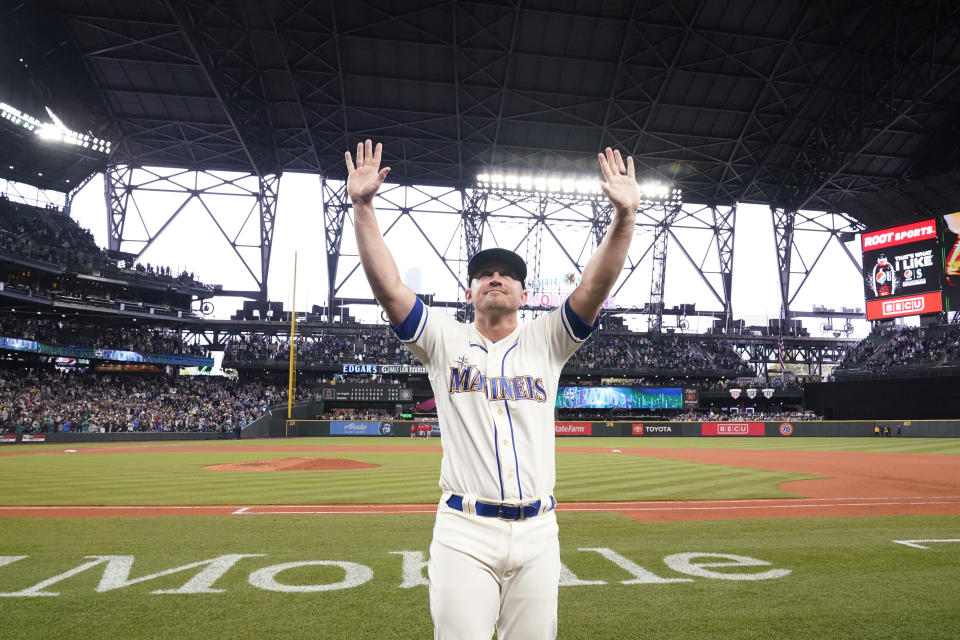 FILE - Seattle Mariners third baseman Kyle Seager waves to fans after a baseball game against the Los Angeles Angels Sunday, Oct. 3, 2021, in Seattle. Seager announced his retirement on Wednesday, Dec. 29, 2021, after 11 seasons in the majors, all with the Mariners. (AP Photo/Elaine Thompson, File)