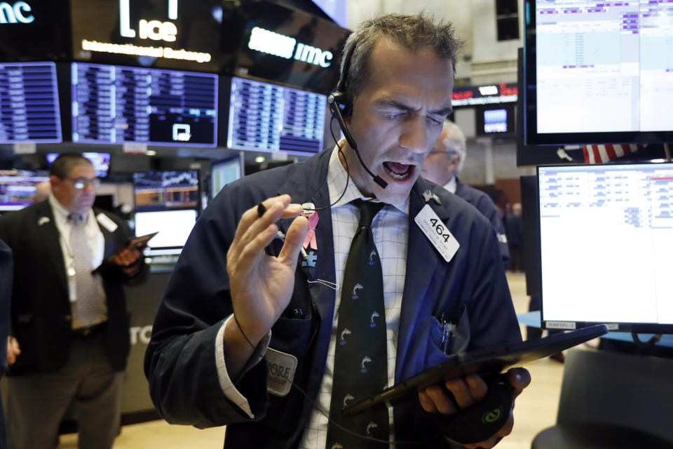 Trader Gregory Rowe works on the floor of the New York Stock Exchange, Wednesday, Sept. 4, 2019. Stocks are opening higher on Wall Street following big gains in Asia as Hong Kong's government withdrew a controversial extradition law that set off three months of protests there. (AP Photo/Richard Drew)