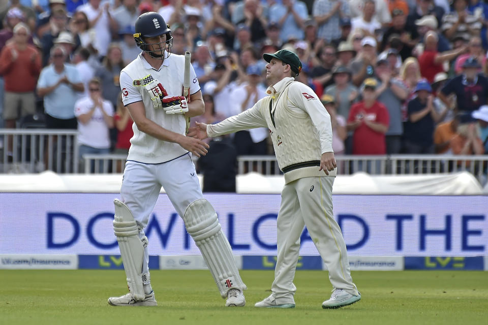 Australia's Steven Smith, right, congratulates England's Zak Crawley, left, as Crawley leaves the field after losing his wicket during the second day of the fourth Ashes cricket Test match between England and Australia at Old Trafford in Manchester, England, Thursday, July 20, 2023. (AP Photo/Rui Vieira)