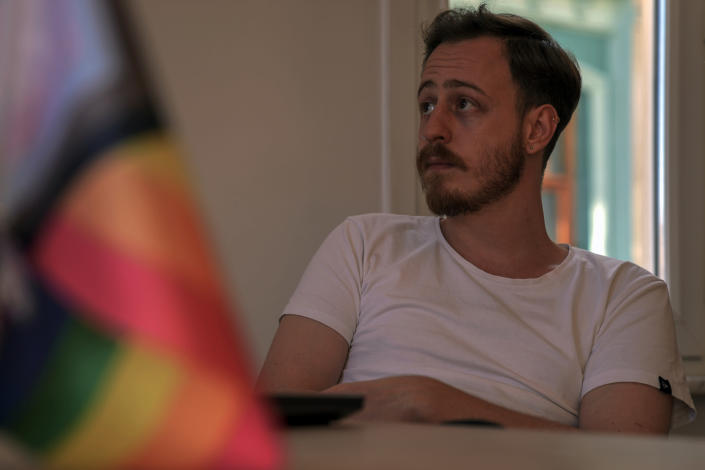 SPoD LGBTQ association lobbyist Ogulcan Yediveren sits before an interview with the Associated Press in his office in Istanbul, Monday, Sept. 19, 2022. (AP Photo/Khalil Hamra)