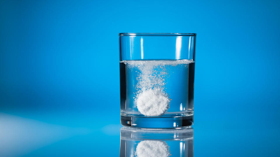 tablet in glass of hydrogen infused water