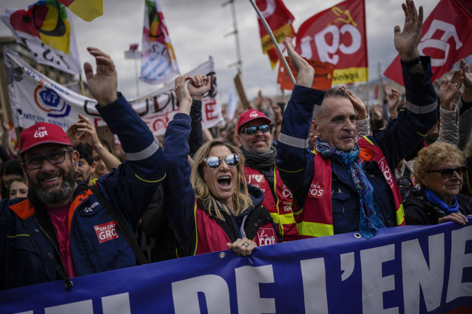 Protesters march during a rally in Marseille, southern France, Thursday, march 23, 2023. French unions are holding their first mass demonstrations Thursday since President Emmanuel Macron enflamed public anger by forcing a higher retirement age through parliament without a vote. (AP Photo/Daniel Cole)